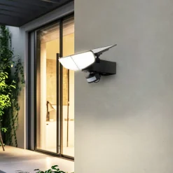 Lindby LED-solcellelampe Naelin, sort, sensor, IP44