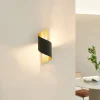 Lindby væglampe Desirio, sort/guld, 24 cm, metal