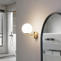 Lucande-væglampe Bidolo, messingfarvet, glas, 12 cm, IP44